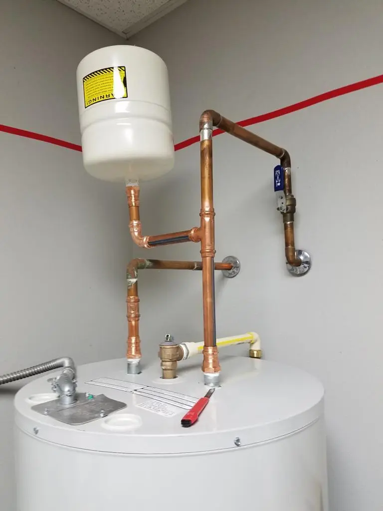 Conventional tank water heater - a traditional solution for heating water with a storage tank.